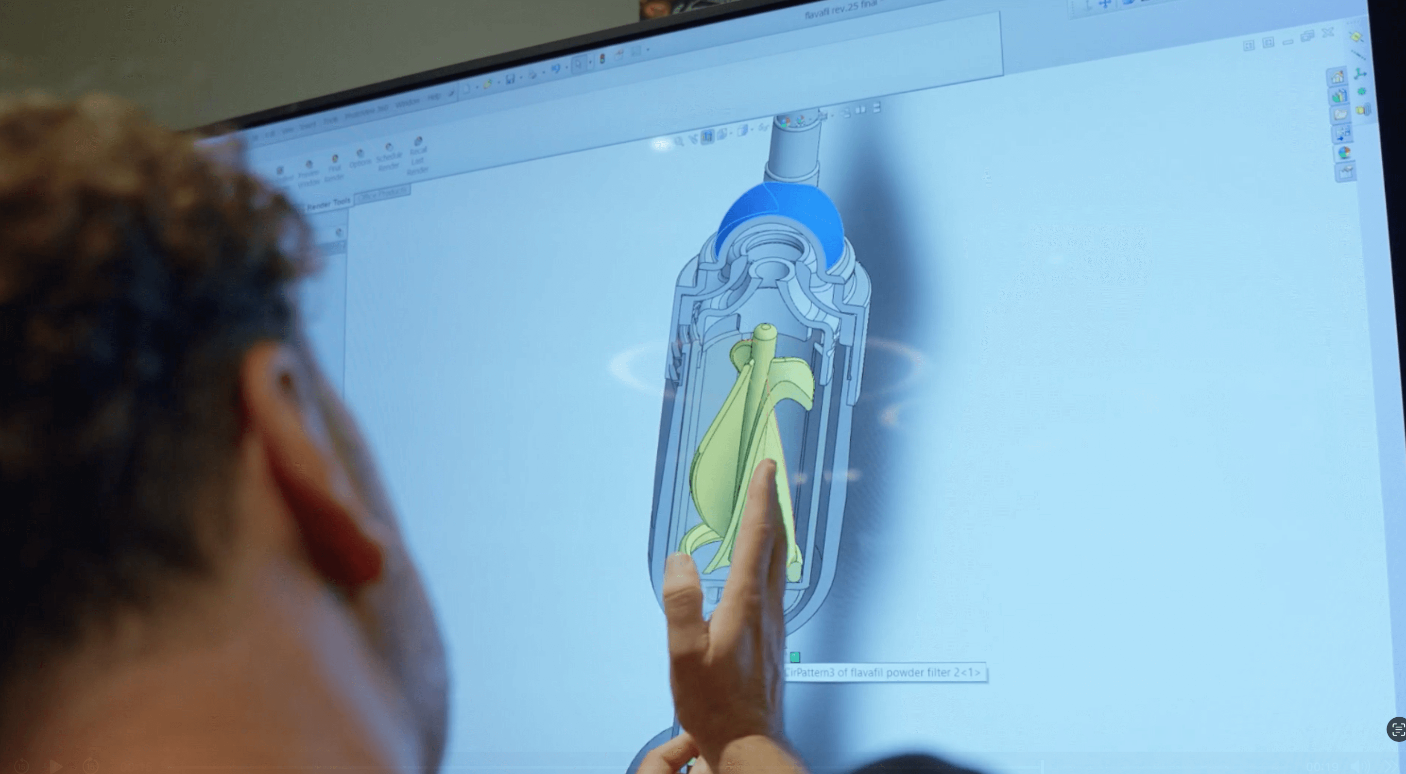 Person pointing to design image on a screen