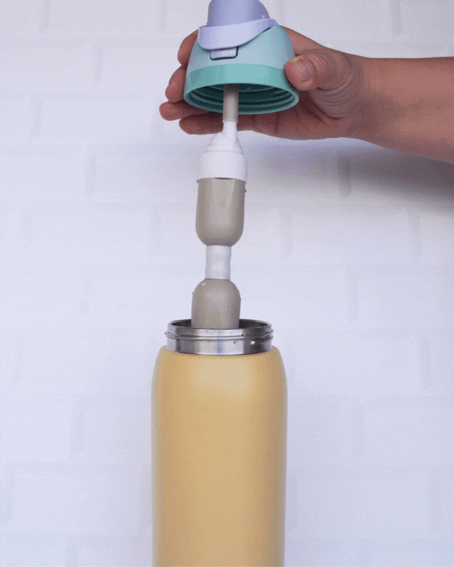 FlavaFil straw being inserted into an Owala water bottle, demonstrating universal fit and secure compatibility.